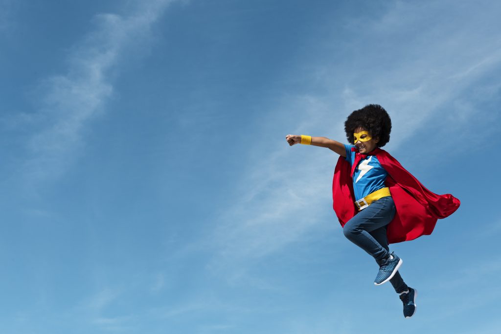 Superhero child in the sky