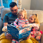 Family reading "The Joyful Adventures" 