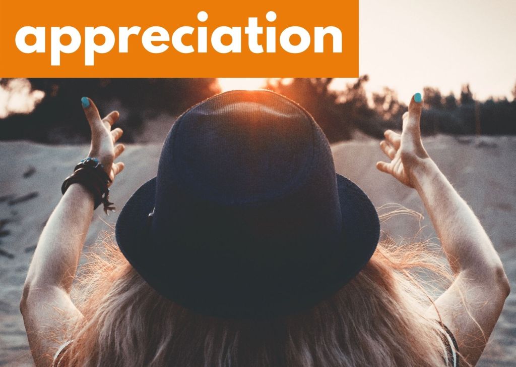 A woman with her arms outstretched and the word appreciation