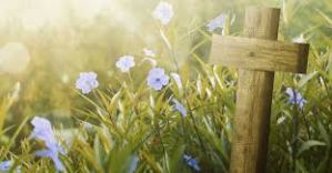 Easter cross in a field of flowers