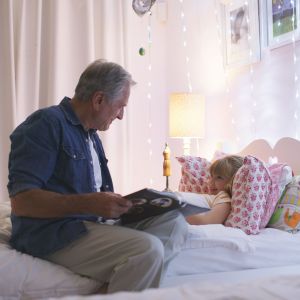 Grandad with child at bedtime