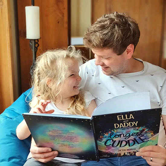daddy-and-ella-reading-longest-cuddle