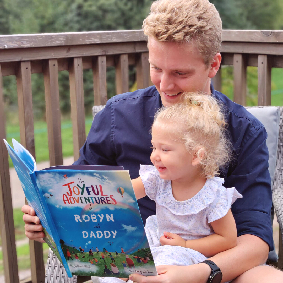 daddy-and-robyn-reading-joyful-adventures