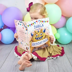 Young child reading The Birthday Boo